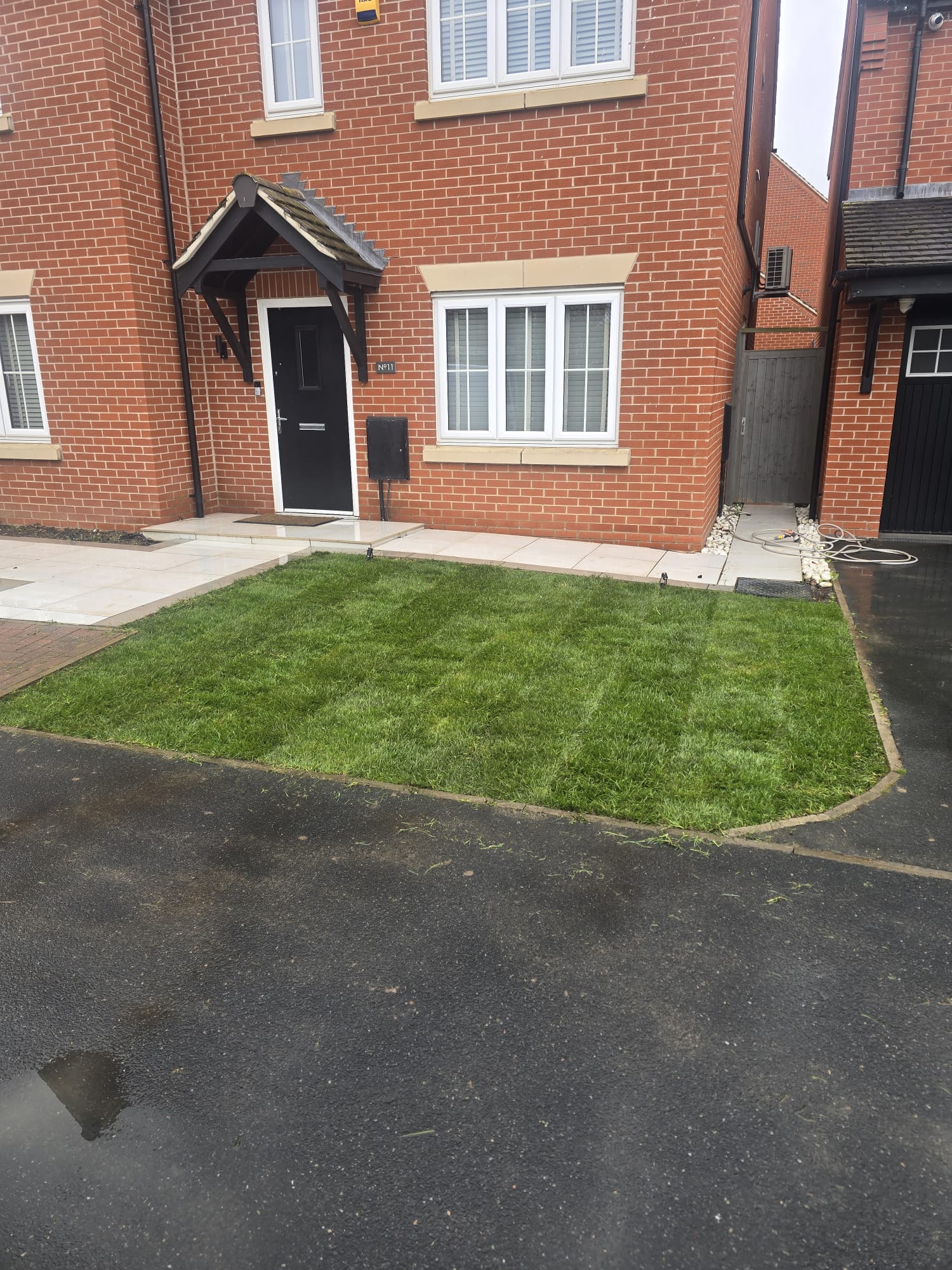 Newly landscaped front garden with lawn