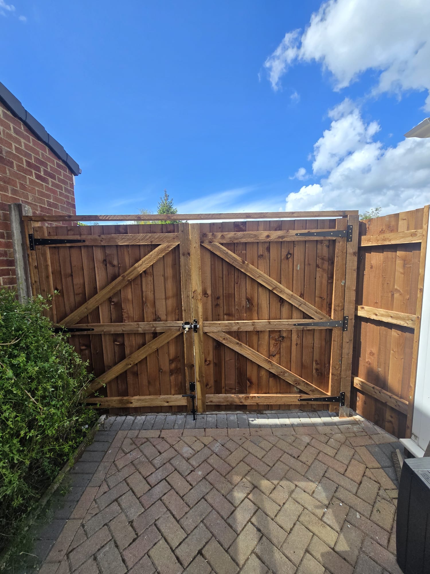 Double driveway gates with X-brace design
