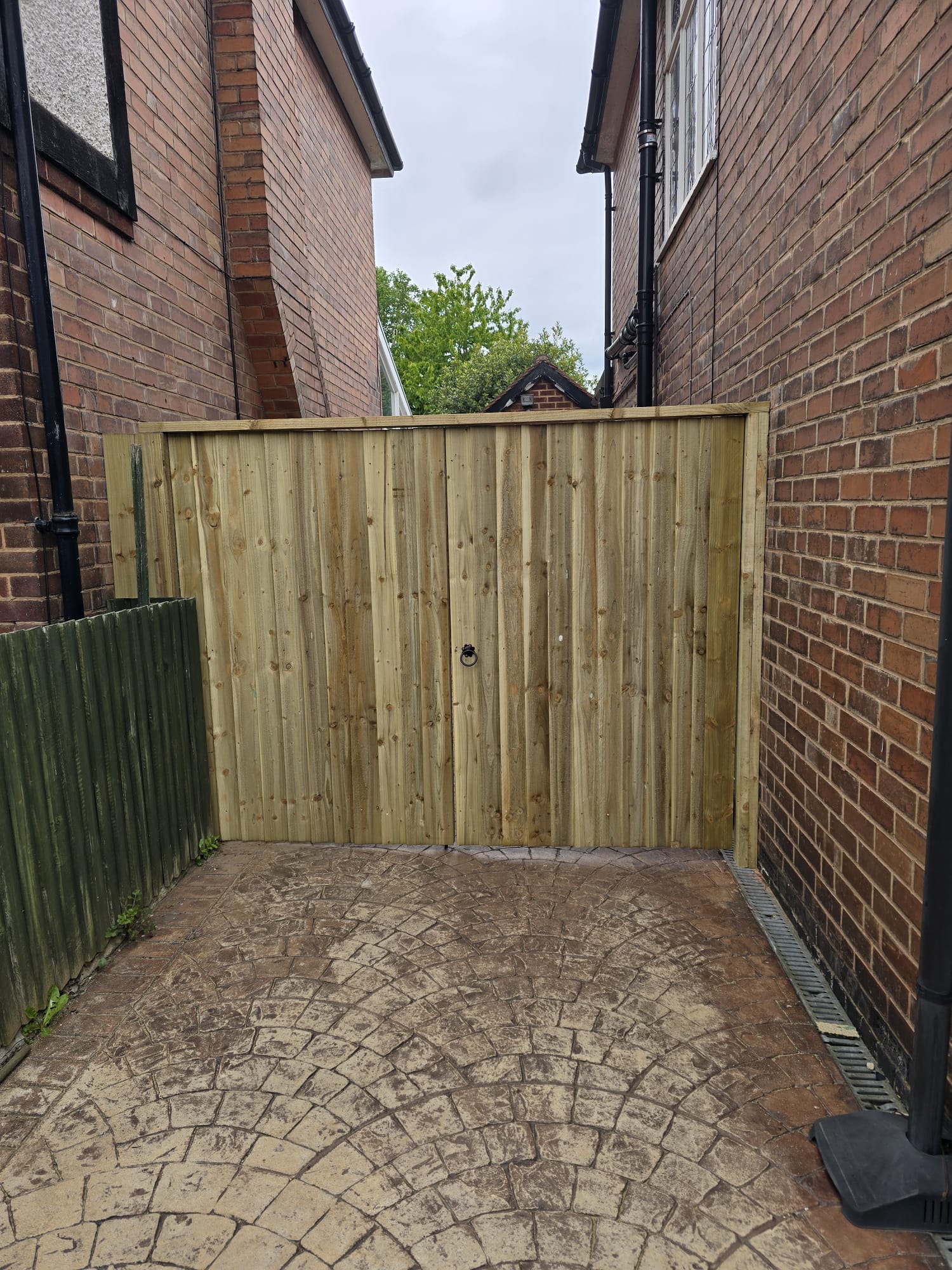 New gate in residential alleyway