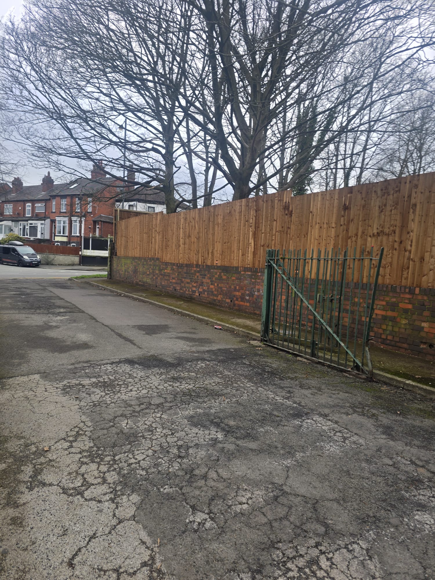 Fence with brick base and gate
